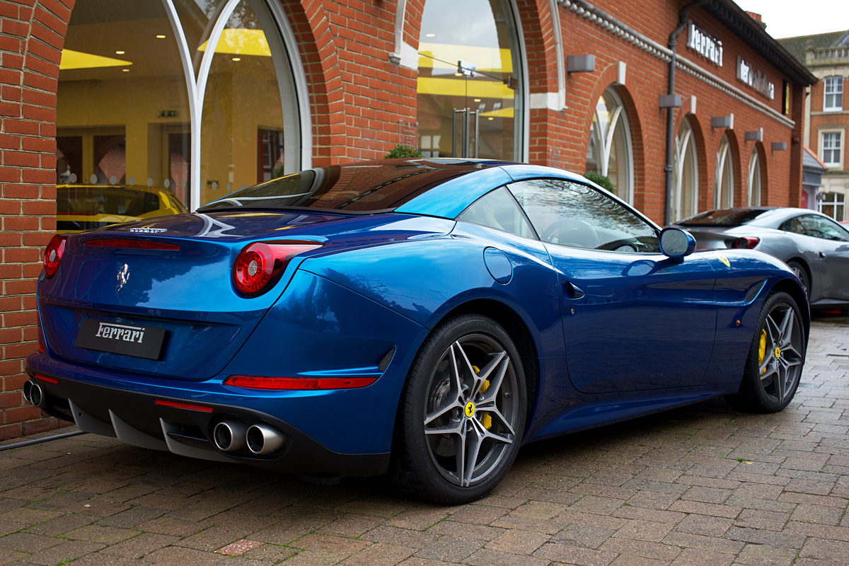 Blue Ferrari Car Parked on the Road